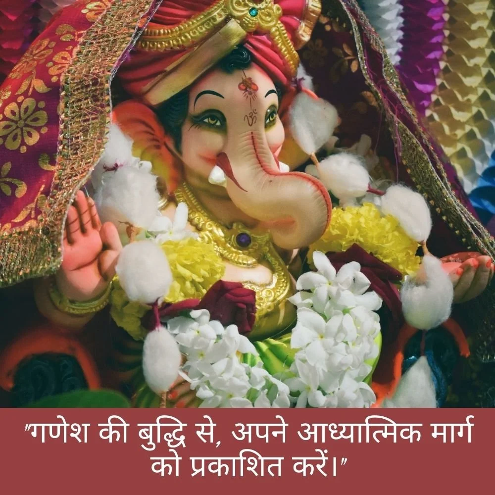 cream-pink smile ganesh stachu is displayed with a garland flowers 