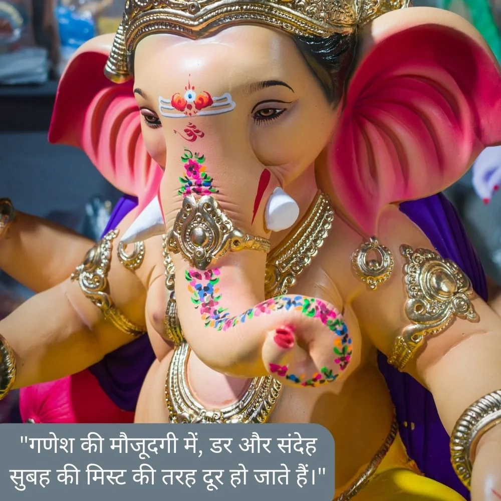 Creame color Ganesh ji stachu. Ganesh ji wear golden color jewellery and placed a beautiful tikka. Spiritual quote is placed, behind the Ganesh ji grey background is set
