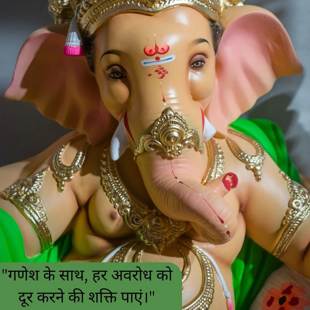 Creame color Ganesh ji stachu. Ganesh ji wear golden color jewellery and placed a beautiful tikka. Spiritual quote is placed, behind the Ganesh ji grey background is set