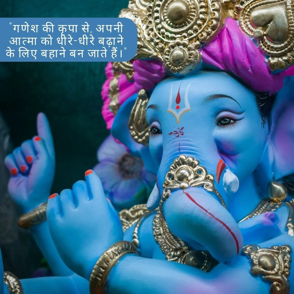 solid blue color Ganesh ji stachu with purple pagdi. Ganesh ji wear silver color jewellery and placed a beautiful tikka. Spiritual quote is placed, behind the Ganesh ji Black background is set