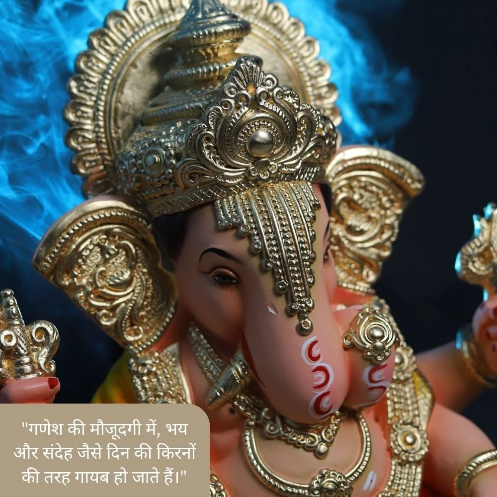 top right camera angle which is shows the ganesh stachu, Ganesh ji wear many jewellery with crown. Spiritual quote is placed 