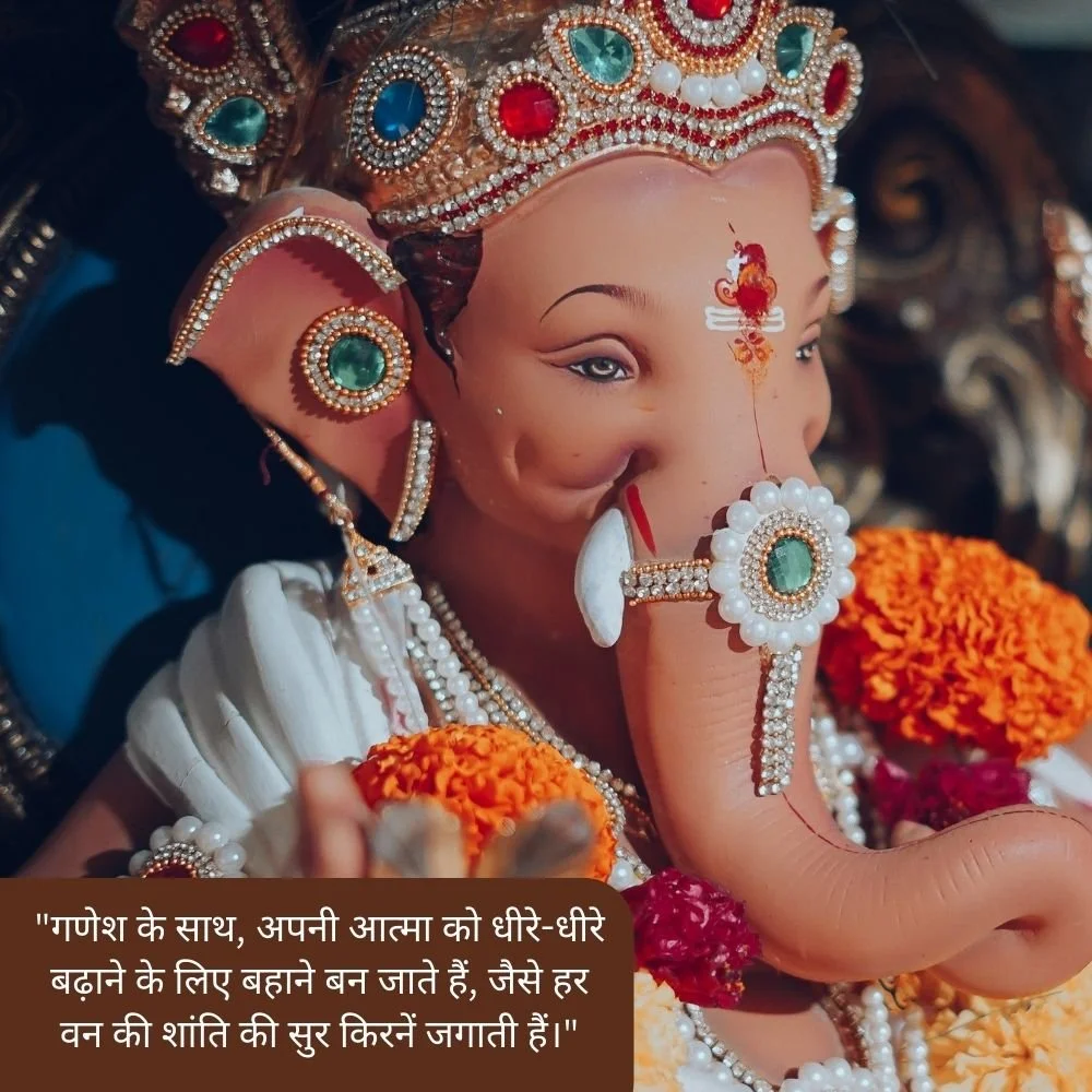 Pink Ganesh ji stachu with flower and spiritual quote is placed