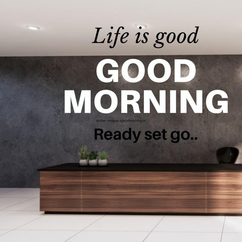 Reception area is visible, brown table and dark grey wall with grey roof, good morning quote is placed