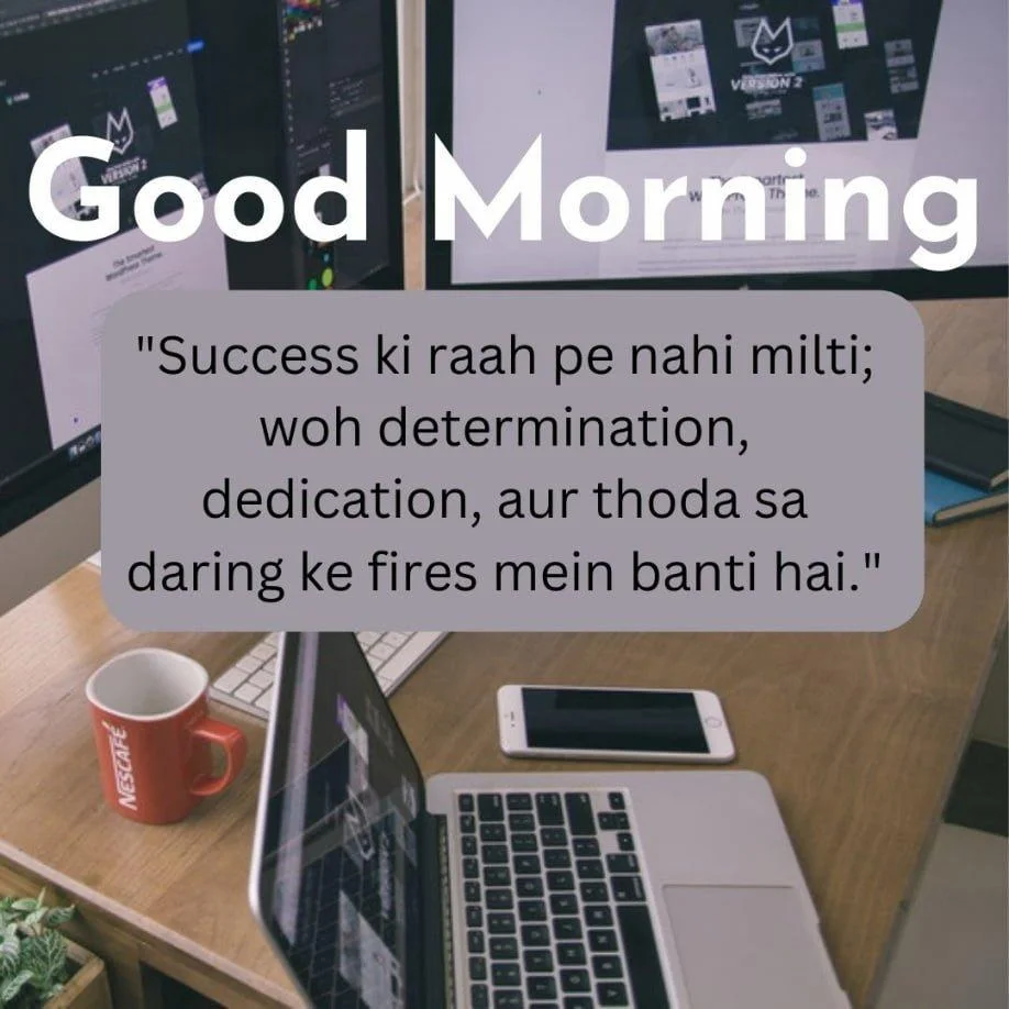 laptop, mobile and red cup on the brown table, good morning quote is placed