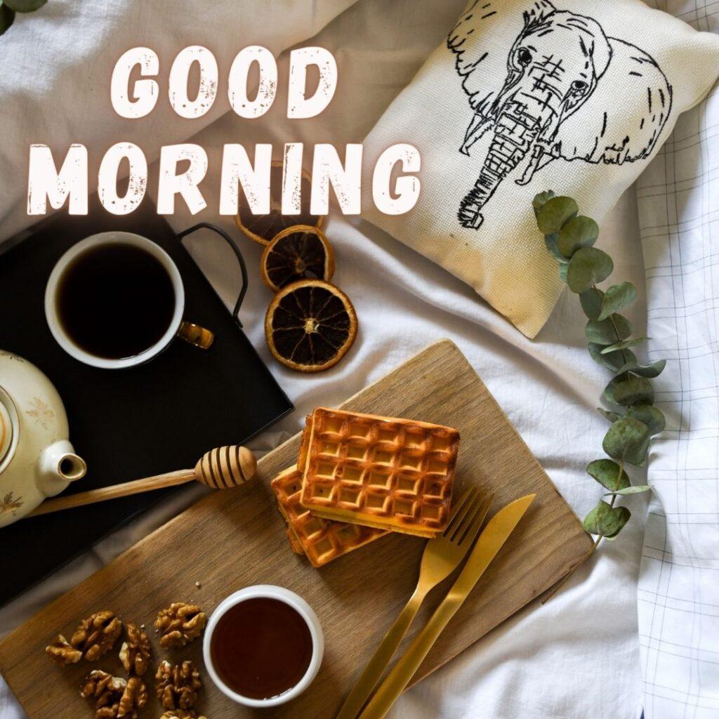 chai waffle on the chopping board beside the elephant print pillow, good morning quote is placed 