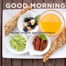 breads, vegetable and many more food inside the plate with good morning quote