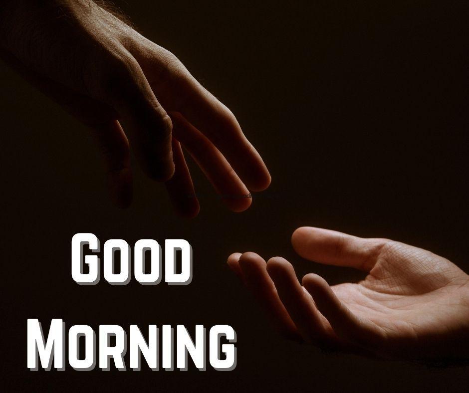 Black background hands touch together good morning image white text