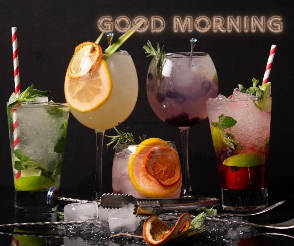 Black-background-with-many-juice-glasses-white-good-morning-text-good-morning-image HD Good Morning Images with juices Free