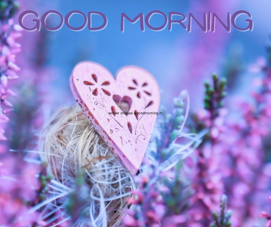 Blue background with pink heart good morning image