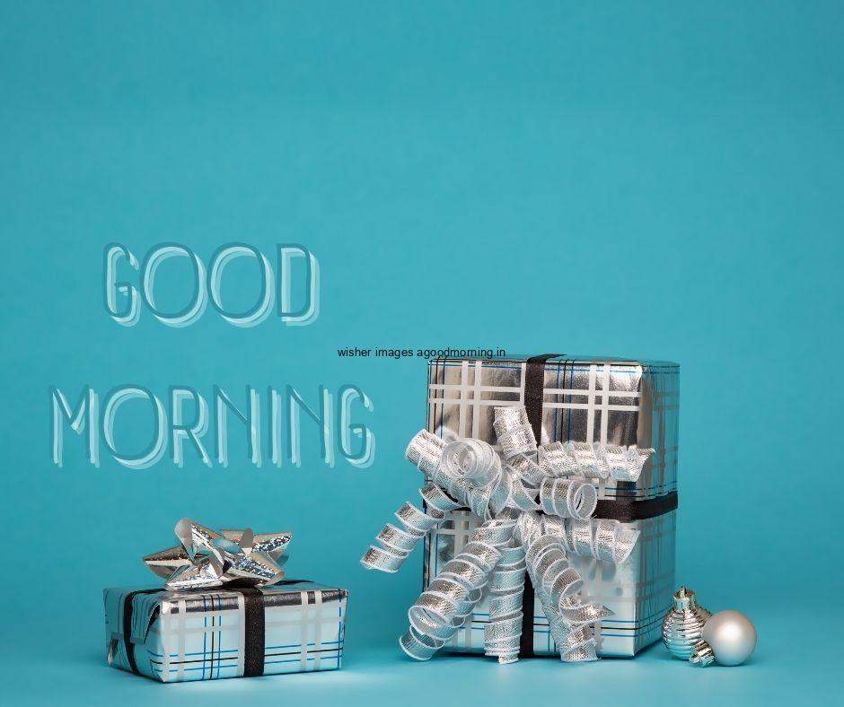 Blue colour background with breautiful siliver colour gift with silver ribbon box good morning images box