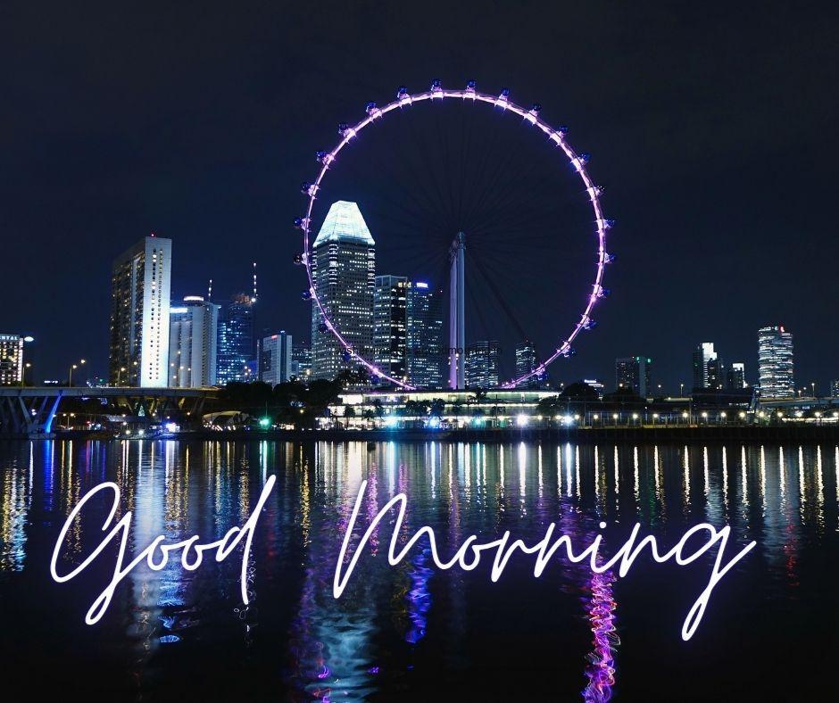 Blue-wheels-placed-middle-building-with-sea-white-text-good-morning-image Top 40+ Good Morning images for common friends