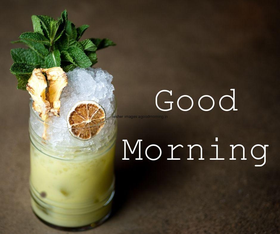 Brown-background-juice-glass-with-orange-white-plates-with-white-text-good-morning-image HD Good Morning Images with juices Free