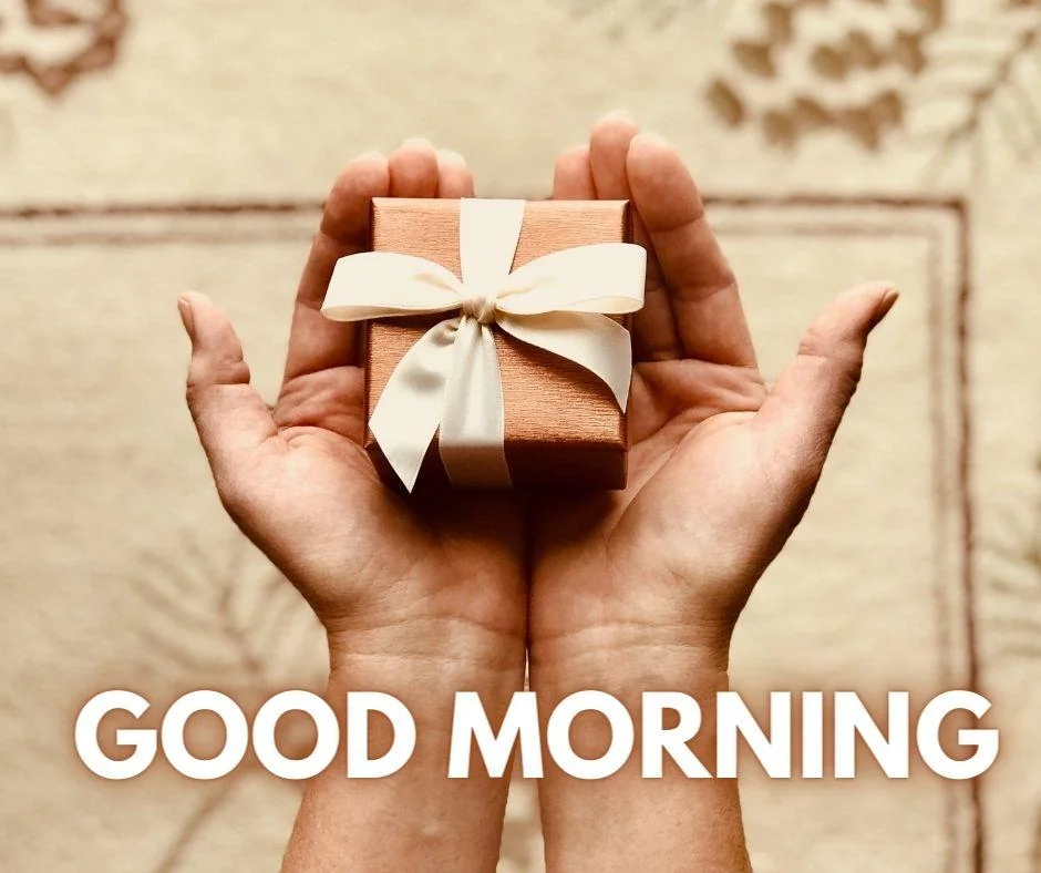 Brown background little boxes in the hand good morning images with golden text