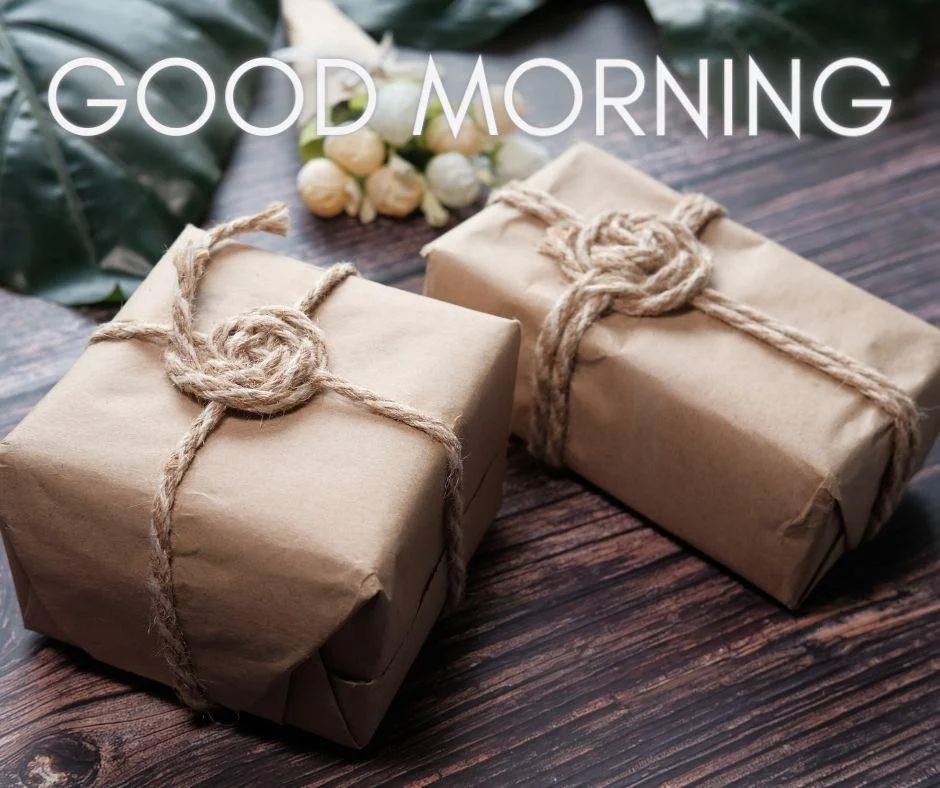 Brown colour table on the background with breautiful brown colour gift boxes, with brown thread ribbon good morning images box