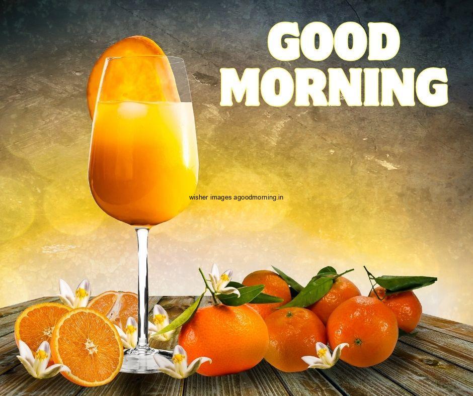 Good Morning food images Mango jucie in the glass yellow with grey background with good morning Food image