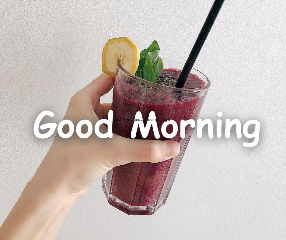 Good Morning food images purple berry jucie girl hand hold the glass grey background with good morning Food image