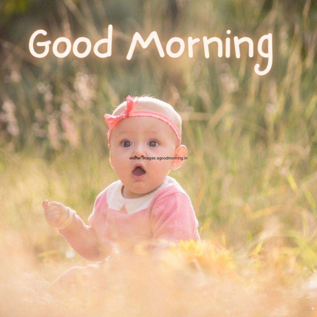 Good morning quote is placed, baby girl sitting in grass, background is setup with brown grass