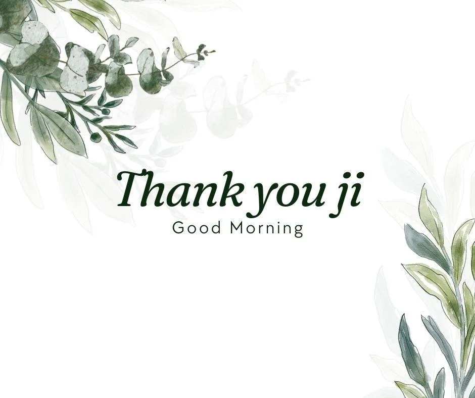 Green leaves with flowers white background good morning quote is placed