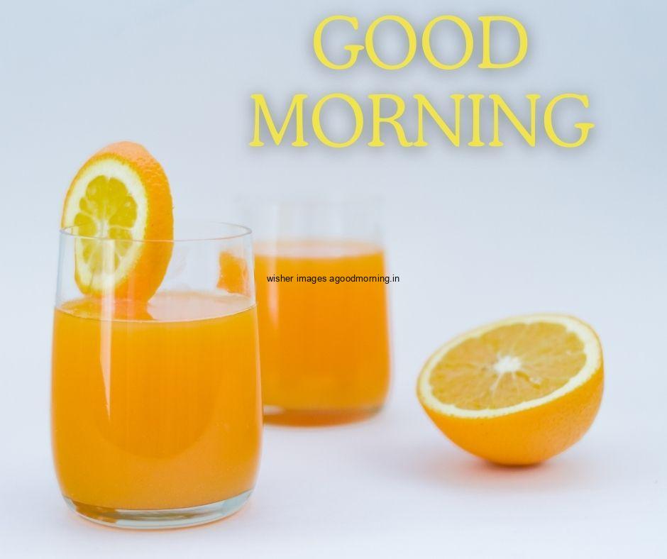 Grey-background-juice-glass-with-orange-many-slices-in-white-plates-with-white-text-good-morning-image HD Good Morning Images with juices Free