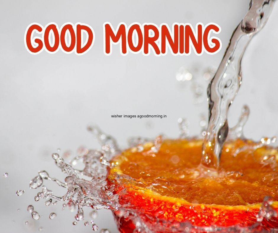 Grey background water drop on half orange good morning image text colour orange with white border