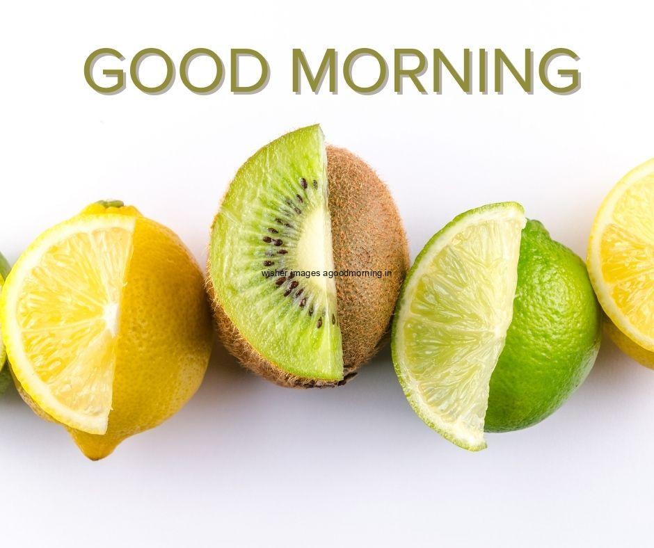 Grey background with half cut fruit orange, kiwi, lemon good morning image text colour green with white border