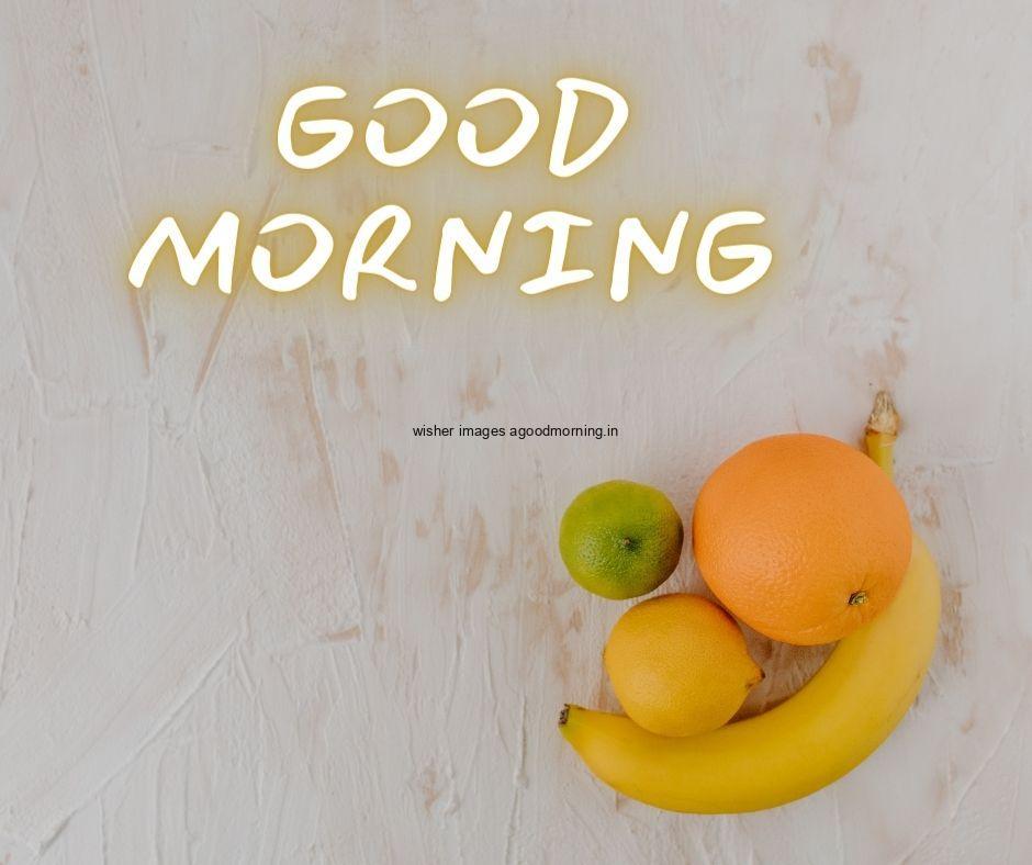 Grey background with orange, banana green apple good morning image text colour yellow with white border