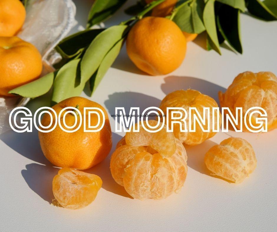 Grey background with orange fruit with leaf with good morning image text colour white with white border