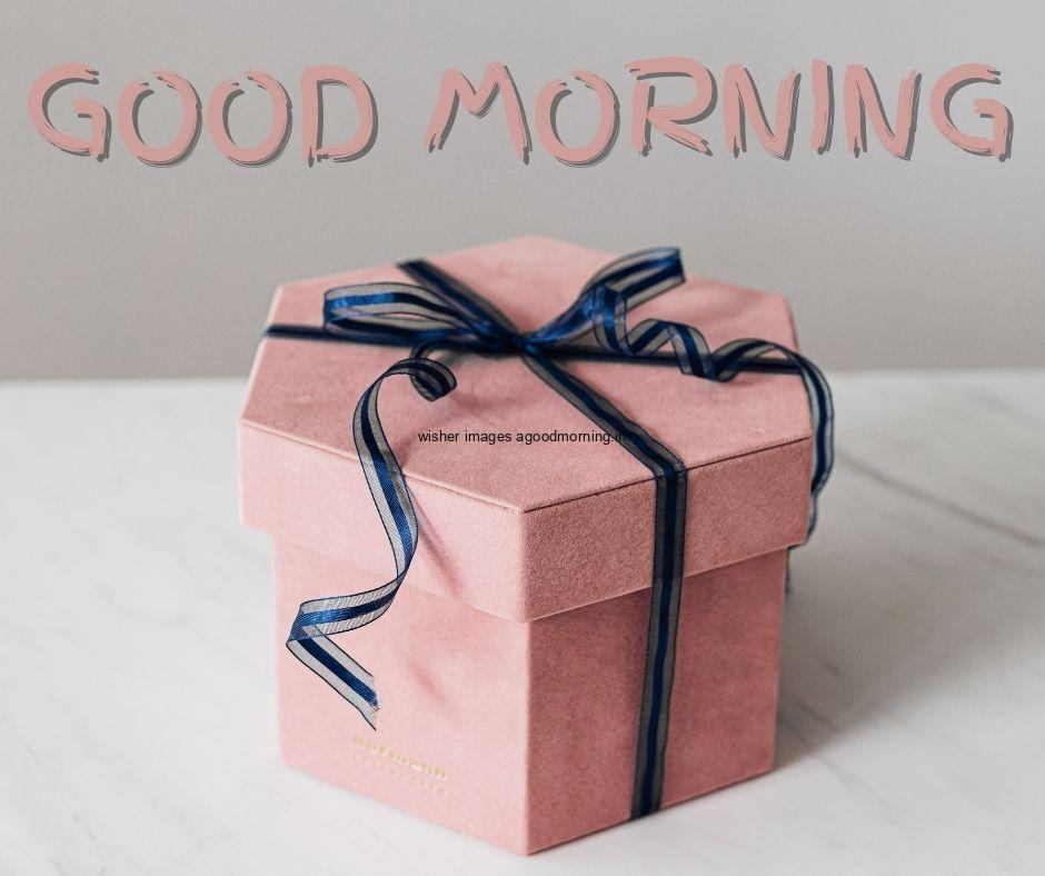 Grey colour background with breautiful pink colour gift box, purple ribbon good morning images box