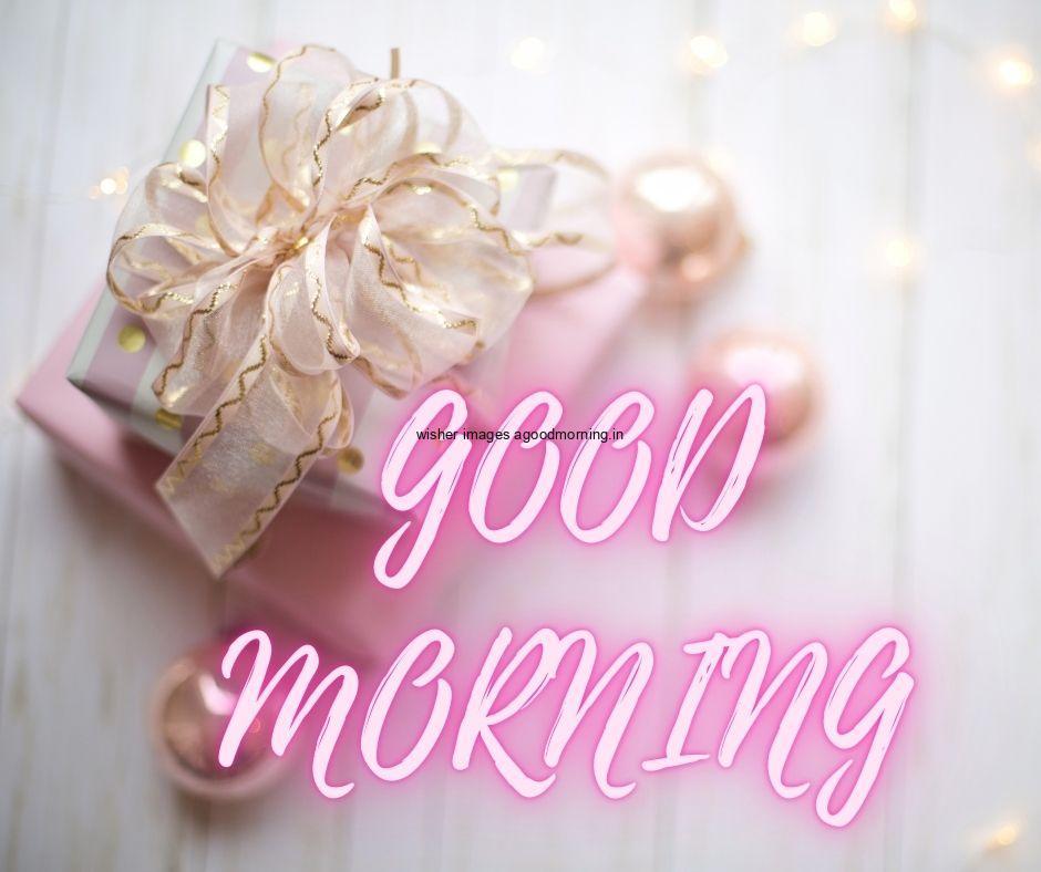 Grey colour background with breautiful pink colour gift boxes, with white with golden ribbon good morning images box