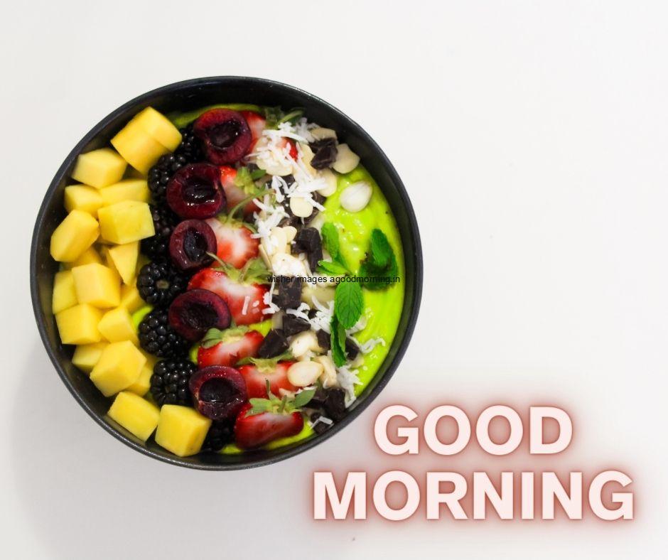 Grey with white background with fruit bowl with pomegranates,strawberry good morning image text colour yellow with white border