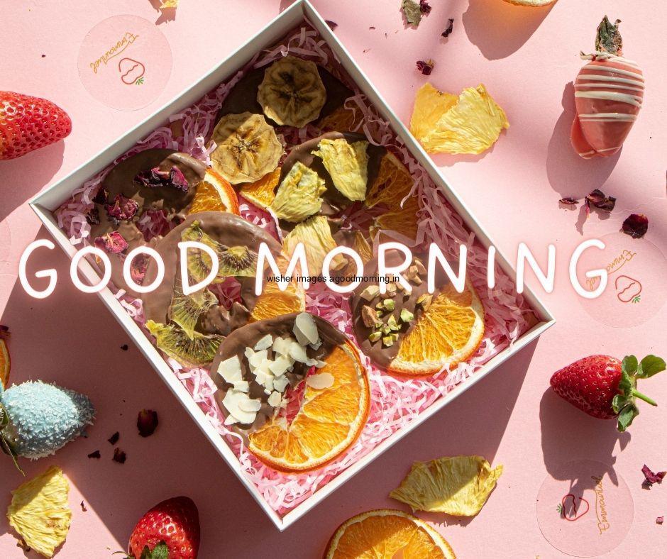 Pink background with orange strawberry in rectangle strawberry good morning image text colour yellow with white border