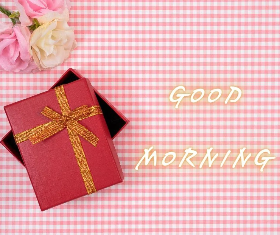 Pink colour background with breautiful red colour gift box with golden ribbon good morning images box