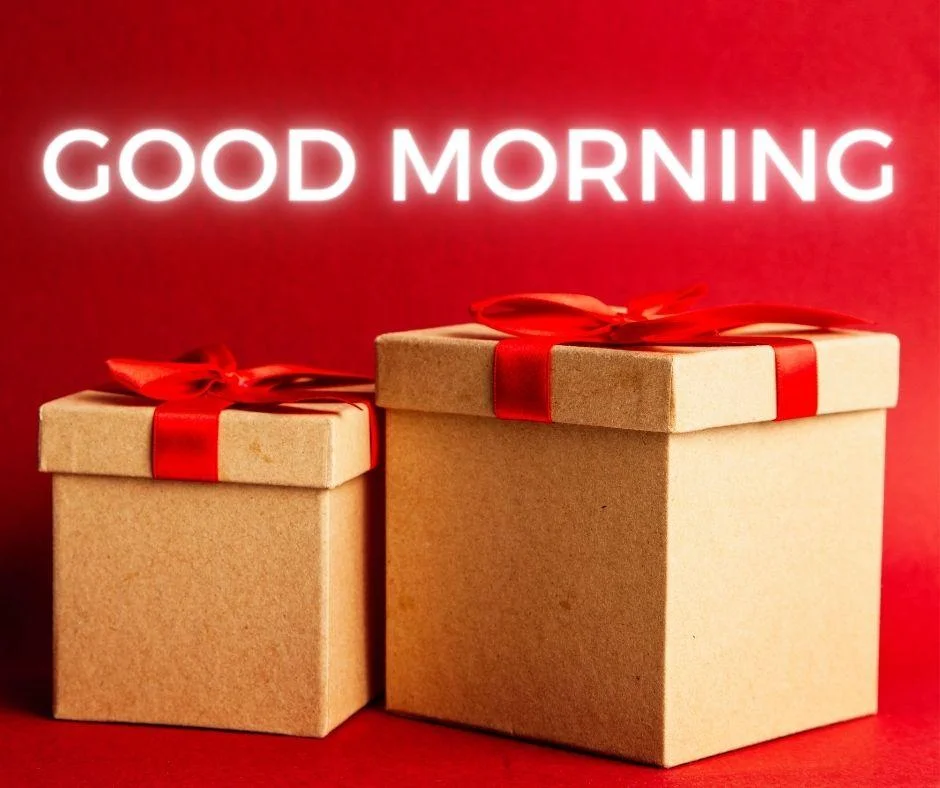 Red colour background with breautiful brown colour gift box with red ribbon good morning images box