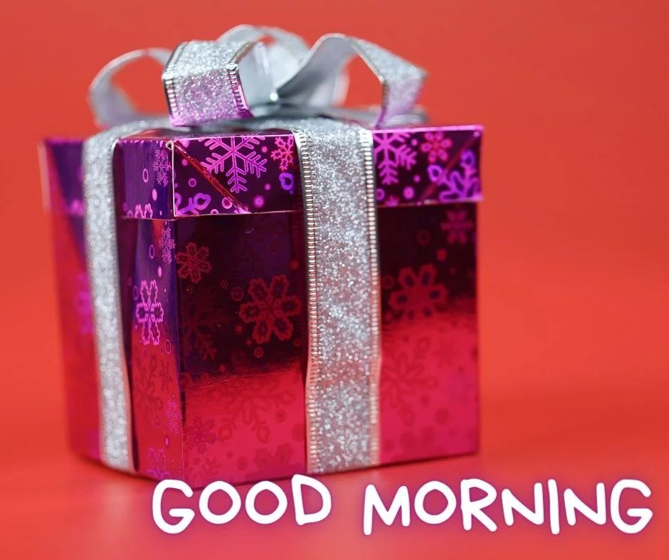 Red colour background with breautiful purple colour gift box with ribbon good morning images box