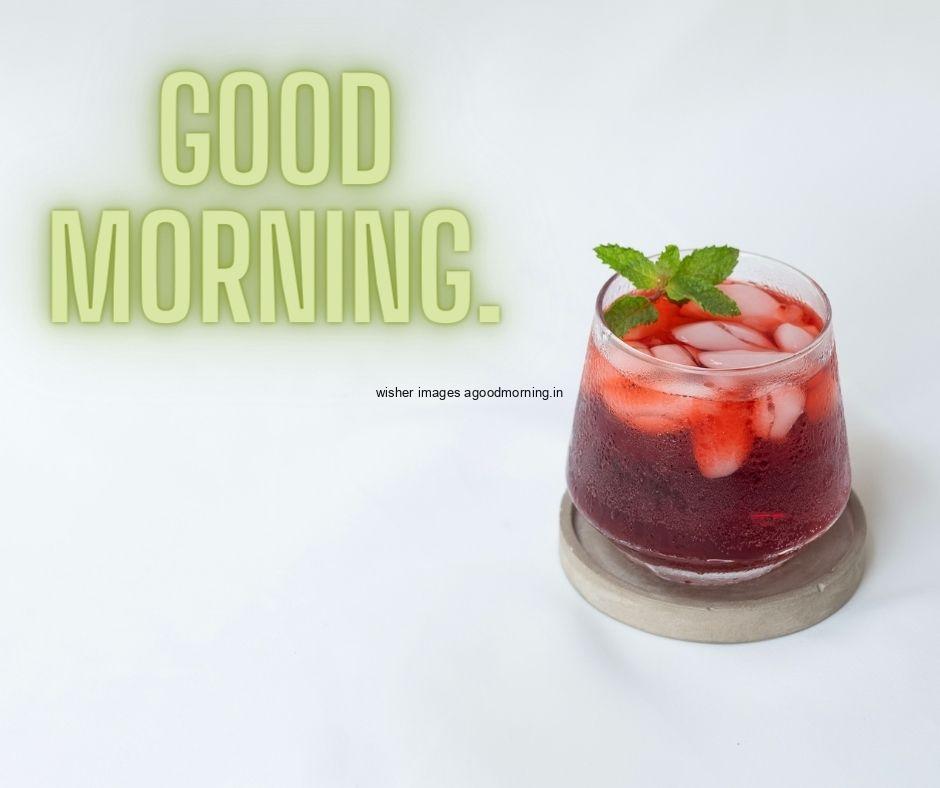 Red juice with Grey background with Green Text good morning text good morning image half cutting fruit