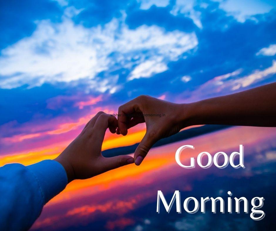 Sky-blue-with-sun-light-background-with-hand-create-heart-shape-good-morning-image HD 60+ Good Morning Images For download