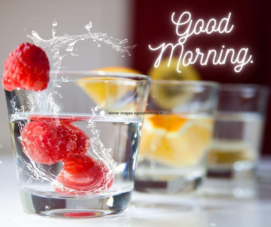 Strawberry in water glass with good morning text good morning food image