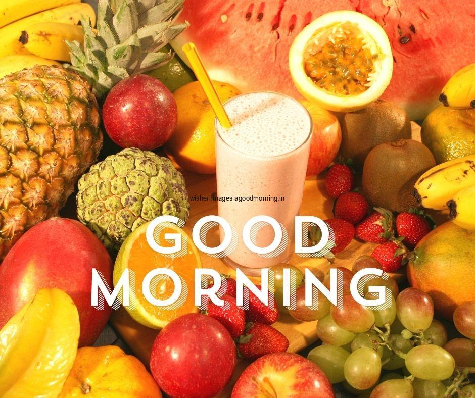 Yellow fruits apple banana graph with jucie with brown wooden background with good morning text good morning image