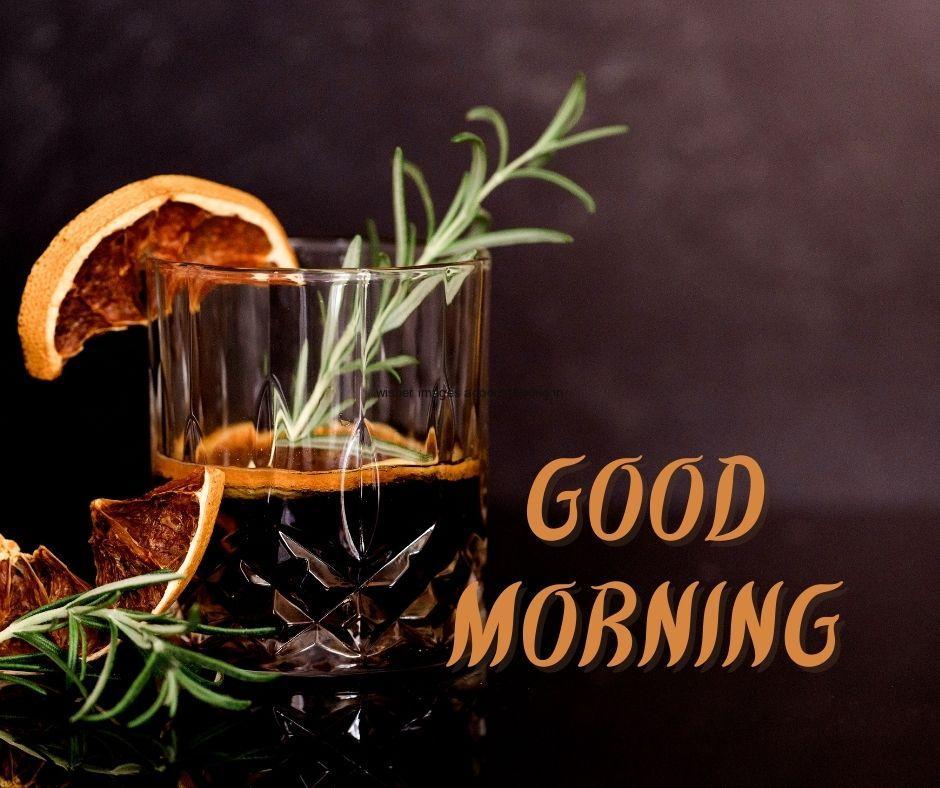 Black tea in glass Black background good morning image text colour brown with white border