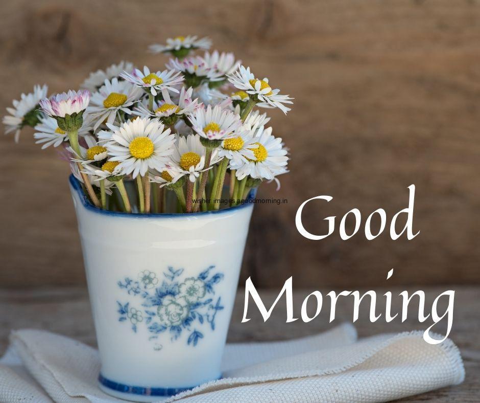 brown-background-with-white-vase-with-printed-flowers-and-beautiful-flowers-in-side-the-vase-good-morning-flower-images-quote-is-placed 60+ Good Morning Flowers images download & share