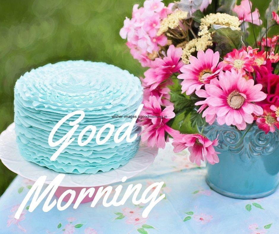 Cake with flowers with blue table good morning flower image