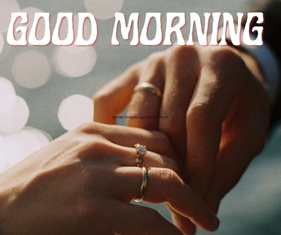 Couple hand with blur background good morning quote is placed