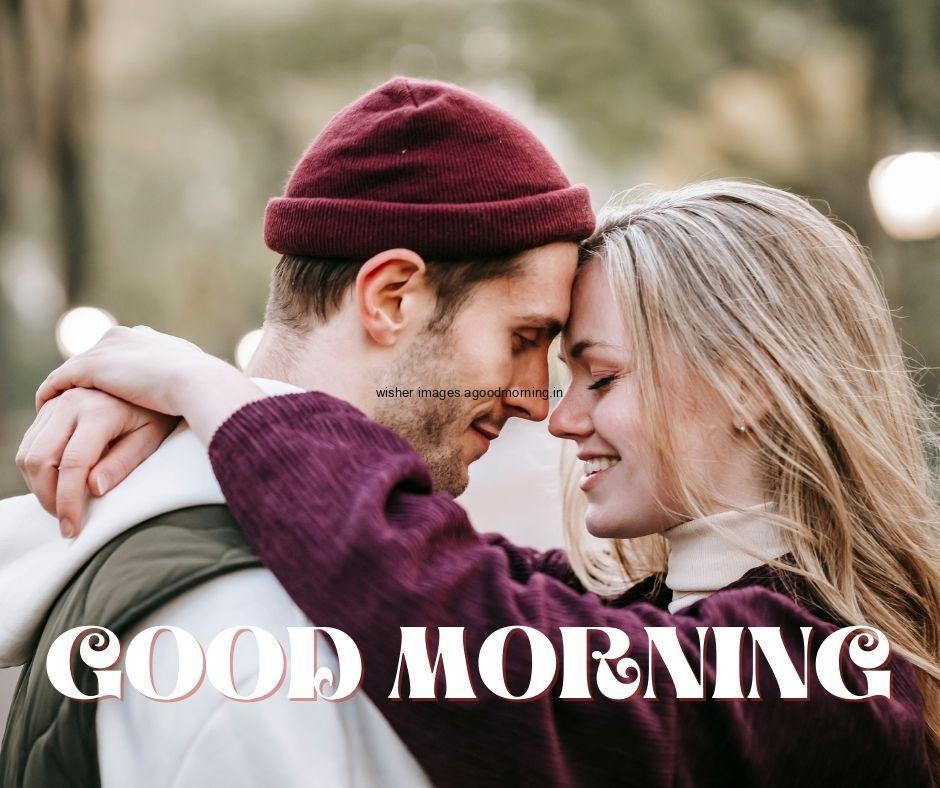 Couple is makes hug good morning quote is placed on the top with white colour