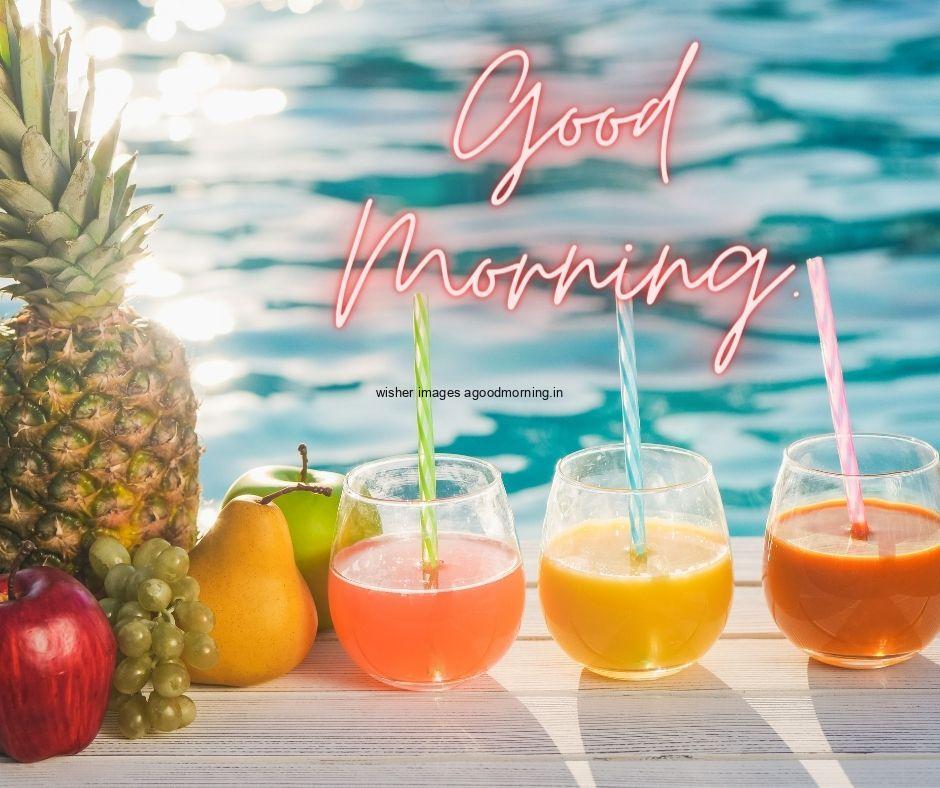 fruits with juice with sky blue background with good morning text good morning image half cutting fruit