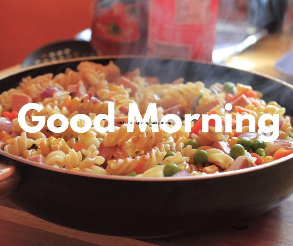 Good morning food images for couple, pasta in black bowl plate and steams is on the air