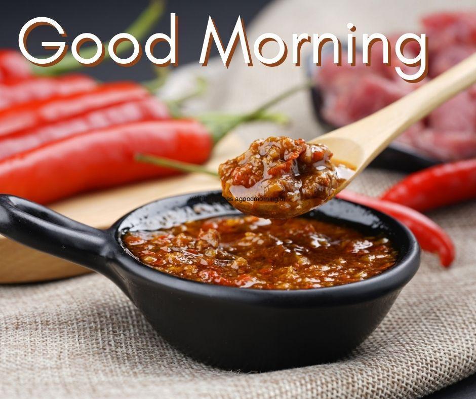 Good morning food images for couple, soup in black bowl with spoon is wooden