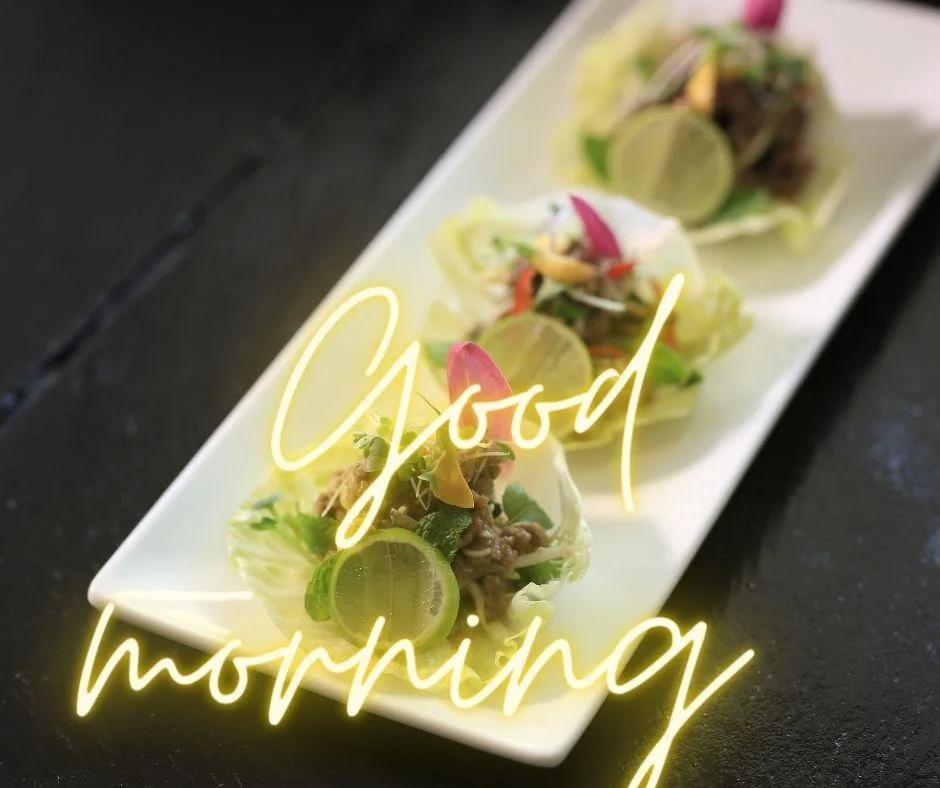 good morning quote is placed and behind the morning quote food is set up in the plates
