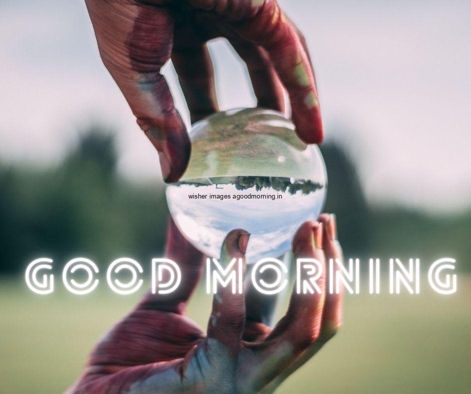 hand hold the circle with blue image good morning images with text