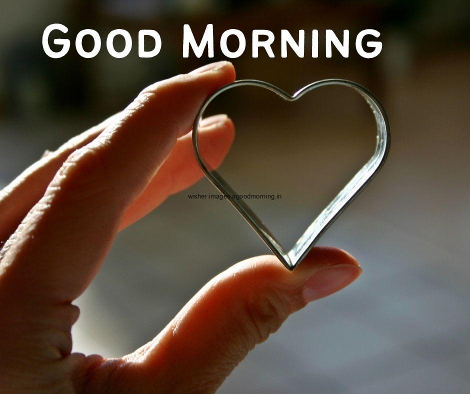 hand hold the heart shape in the hand good morning love image