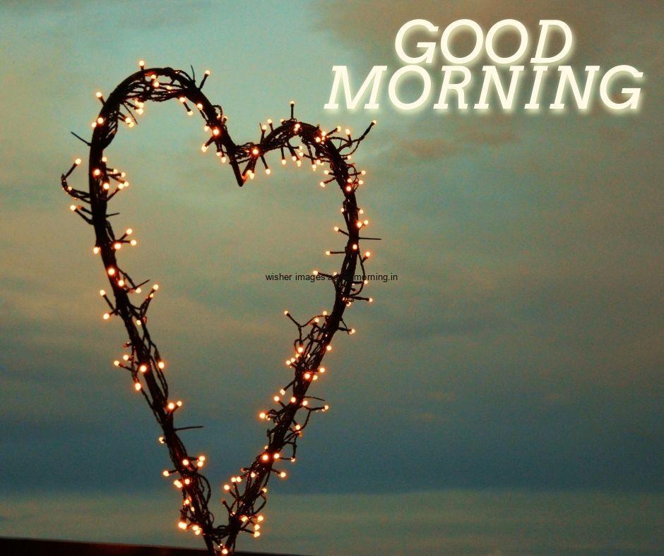 Hearts create with lights with sky background is setup white colour good morning quote is placed